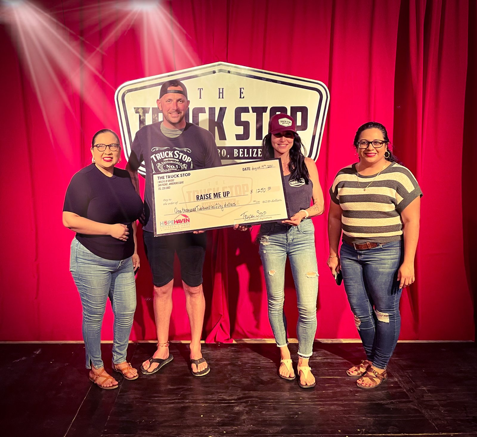 The Truck Stop presenting a cheque to Raise Me Up for Hope Haven